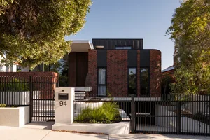 Modern residential building with brick exterior.