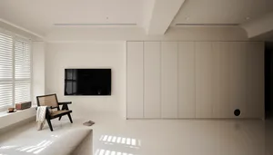 A minimalist living room featuring neutral colors and a sleek, modern design.