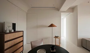 A minimalist living room with neutral-toned materials and a modern design.