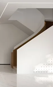 A modern interior featuring a white marble staircase and floor.