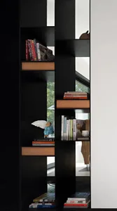 A modern library featuring black wooden shelves with metal accents.