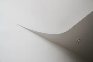 A minimalist architectural design featuring a concrete line.