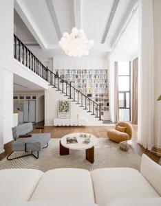 Modern living room with contemporary furniture and lighting design.