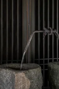 A minimalist granite sink, featuring a sleek and modern design.