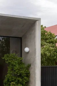 Concrete facade with minimalist design and greenery