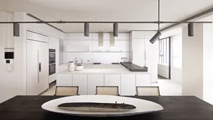 A modern, minimalist kitchen with white cabinets and a sleek, white countertop.