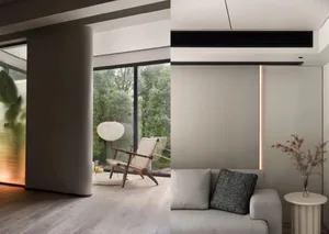 A minimalist living room with a white sofa, modern chair, and large windows overlooking greenery.
