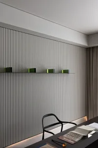 A modern office with metallic vertical panels and a sleek desk setup