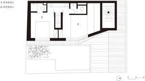 A modern architectural floor plan on paper, showing layout and design details.