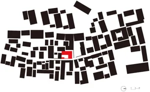 A black and white map of an urban area with a red square marking a specific location.