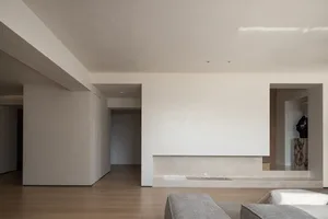 A modern minimalist living room with marble elements.