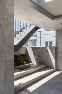 Modern indoor architecture featuring minimalist design and concrete materials.