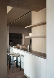 Modern kitchen featuring wooden countertops and cabinets.