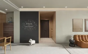 A modern living room featuring a mix of materials including wood and leather, with a chalkboard wall, a wooden rocking sheep,