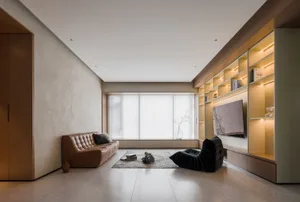 A contemporary living room with wood elements and a large window allowing natural light to stream in.