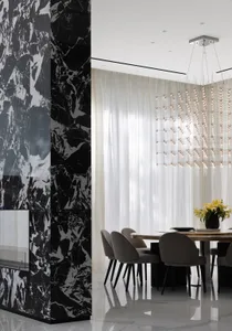 Modern dining room featuring marble accents and contemporary design elements.