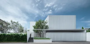 A modern metal house featuring a minimalist design and sleek lines.