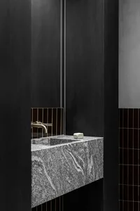 Modern bathroom featuring a granite countertop with a minimalist design.