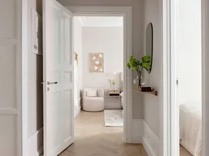 A minimalist bedroom with neutral materials and a cozy ambiance.