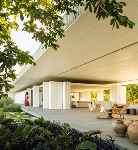 Modern living room with concrete walls and a minimalist interior design.