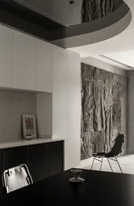 A modern office space featuring concrete walls and a minimalist design.
