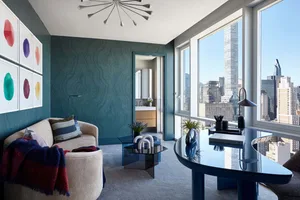 A modern residential interior featuring neutral tones and a calming, minimalist design.