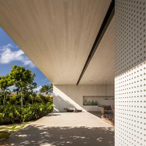 A modern exterior home with a minimalist design, featuring concrete materials and a sleek, clean aesthetic.