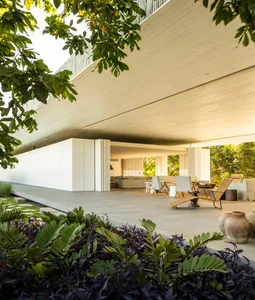 Concrete exterior of a modern house with a garden.