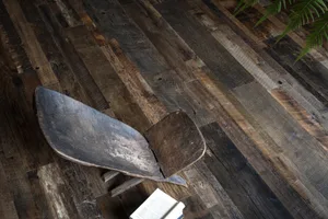 An industrial-style bookshelf made of reclaimed wood.