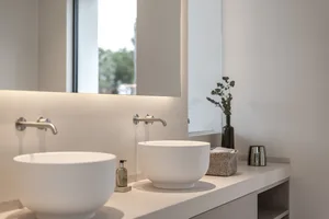 Modern bathroom interior with concrete counter and sink.
