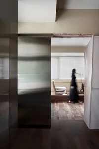 A modern residential interior with metallic walls, showcasing contemporary design elements.