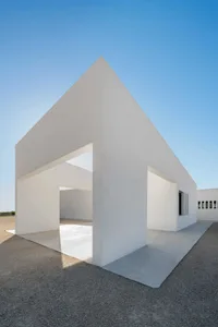 A minimalist building exterior made of concrete.