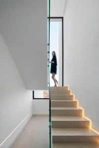 Modern concrete staircase with integrated lighting.