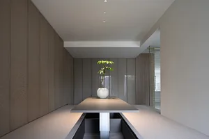 A minimalist office space with a white desk.