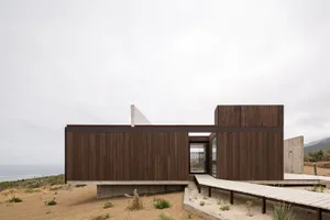 A modern residential building with wood and concrete materials