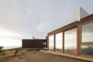 Modern residential architecture featuring wood and glass materials.