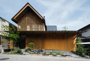 A modern residential house exterior featuring wooden siding.