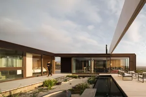 A modern house with wooden and glass elements.