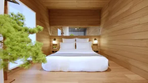 A minimalist bedroom with wooden walls and a large window.
