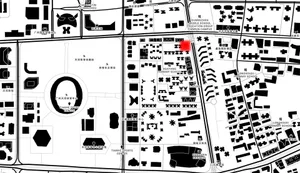 Black and white map of an urban area showing various buildings and streets.