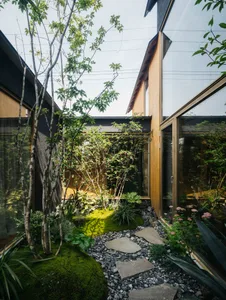 modern residential interior with wooden accents and glass walls