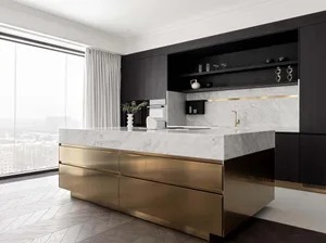 Modern kitchen with marble countertops, brass accents, and a large window.