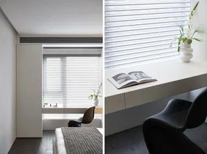 A minimalist space with a white window featuring blinds, a sleek desk, and a black chair.
