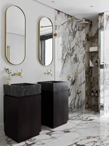 Modern bathroom with marble walls, brass fixtures, and wooden vanity
