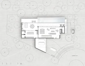 Floor plan of a modern house, depicted on paper with white lines on a textured gray background.