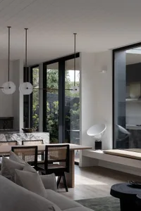 Minimalist modern interior design featuring marble and concrete materials.