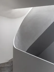 Grey concrete spiral staircase with minimalist design