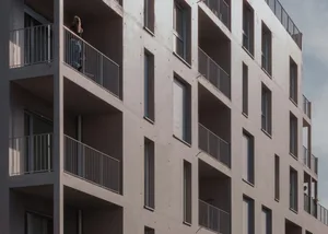 Modern residential building with balconies made of concrete.