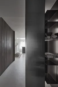 Modern kitchen counter with black metal frame and dark wood surface