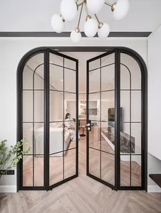 Modern bedroom with glass doors and wooden floors, featuring a cozy and contemporary design.